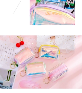 Close-up of holographic PVC mini coin purse with gold zipper and metal keychain