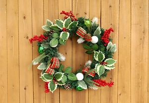 Detailed close-up of 50cm Christmas wreath with red berries, pine cones and plaid bow