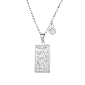 Detail of silver Libra tarot pendant necklace with engraved goddess and zodiac symbol