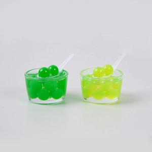 Miniatuur fruitgelei kommen met lepels in groen en geel voor sleutelhangers