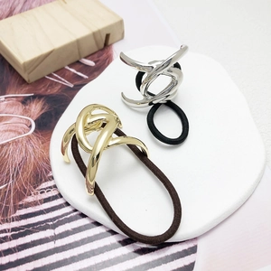 Minimalist U-shaped metal hair ties in gold and silver finish with elastic cords