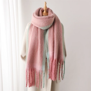 Pink and mint green striped faux cashmere scarf with tassels on wooden mannequin