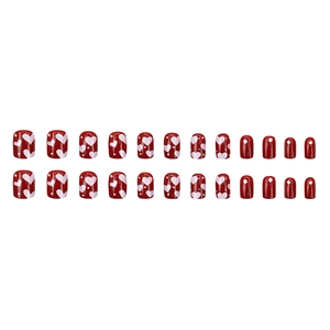 Red cherry color press-on nails with white heart patterns and glossy finish 24pcs set