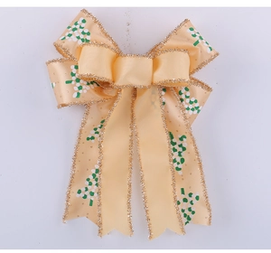 Detail of double-layer Christmas bow decoration with gold glitter edges and dot patterns