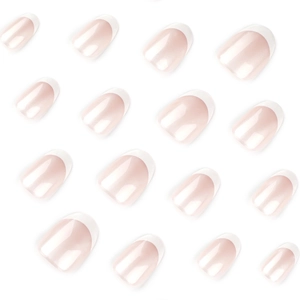 Short round French press-on nails with white tips and shimmering nude pink base