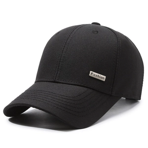 Minimalist black cotton baseball cap with silver Fashion metal plaque on a white background