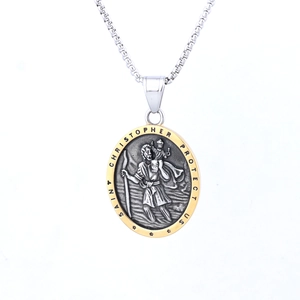 Close-up of Saint Christopher pendant necklace with embossed relief and gold outer rim