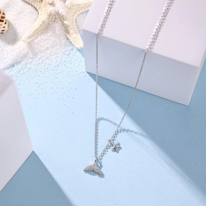 Elegant S925 sterling silver mermaid tail necklace with sparkling zircon starfish charms