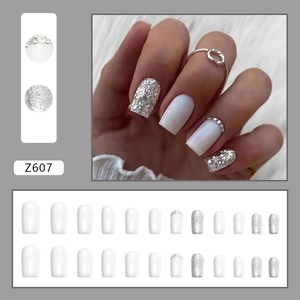 Press-on nail set featuring pearl white and silver glitter square oval style nails