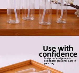 Close-up of a clear PET pump bottle with cap on a rustic wooden tray with white flowers