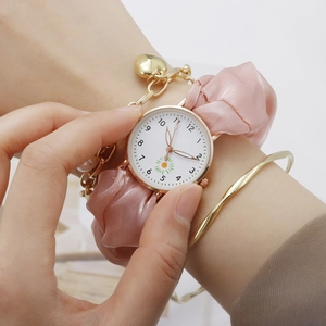 Floral quartz watch with pink silk scrunchie strap and gold heart bracelet set