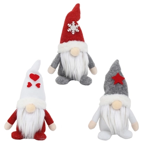 Three Christmas forest gnomes with long hats and white beards for holiday decor