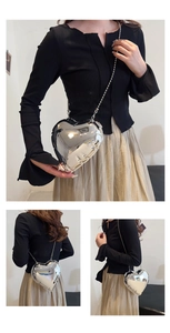 Three views of a heart-shaped silver metallic crossbody bag worn with a chain strap