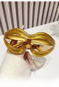 Lip-shaped Y2K sunglasses with yellow transparent frames and dark brown tinted lenses