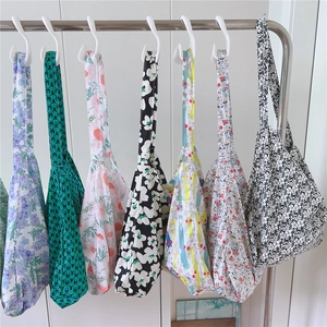 Collection of printed cotton tote bags in diverse floral and geometric patterns