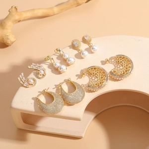 Selection of five pairs of 14K gold plated earrings with pearls and cubic zirconia stones