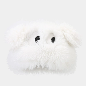 Detail of plush white winter hat featuring large cartoon eyes and soft faux fur texture
