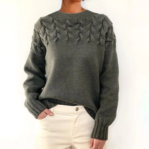 Detailed cable knit pattern on dark grey high neck sweater with long sleeves