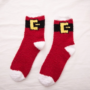 Plush red Christmas Santa socks with white fuzzy trim and belt buckle design