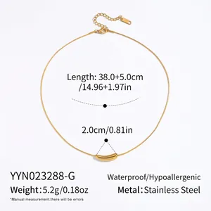 Detail view of gold-plated curved pipe pendant on a stainless steel snake chain necklace