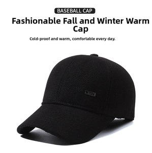 Detail view of winter baseball cap with side metal logo and textured twill fabric
