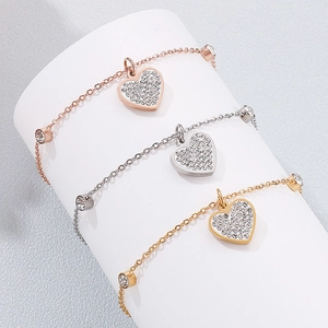 Detailed view of titanium steel heart bracelets in rose gold, silver, and gold plating