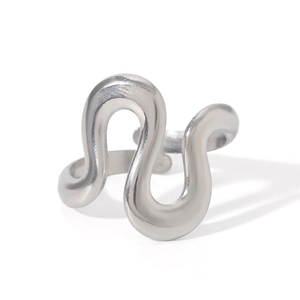 Detailed view of silver stainless steel open ring with fluid S-shaped wave design