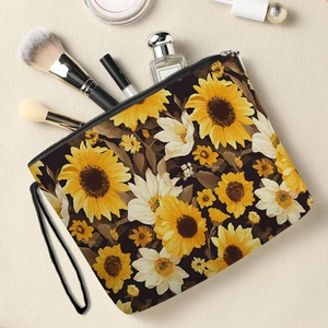 Floral makeup bag with sunflower print, zipper closure and black carry strap