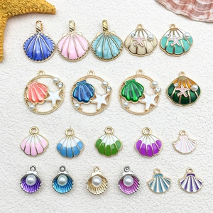 Macro shot of assorted colorful enamel shell and starfish pendants for DIY jewelry making