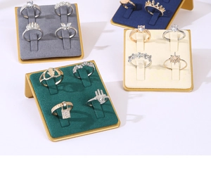 Detail of 4-slot metal ring display stands with velvet lining in multiple colors