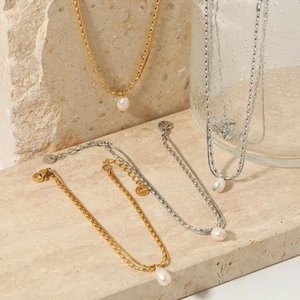 Double-layered snake chain necklace and bracelet set with natural pearls in gold and silver