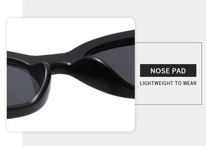 Detail view of integrated lightweight nose pads on black oval sunglasses for comfort