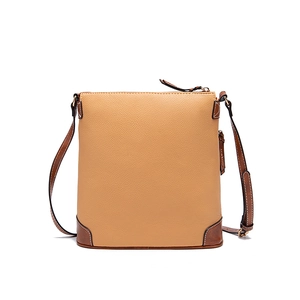 Close-up of litchi texture on brown two-tone crossbody bag with metal zipper detail