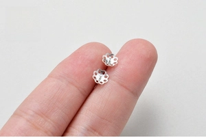 Macro view of S925 sterling silver plum blossom earring settings for DIY jewelry making