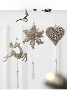 Champagne gold glitter ornaments with reindeer, snowflake, heart shapes and white tassels