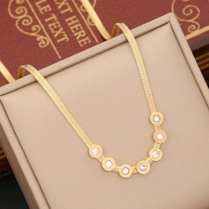 Golden herringbone chain necklace with six roman numeral cubic zirconia ring pendants