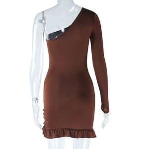 Detail view of brown one-shoulder long sleeve dress with elegant ruffled hemline