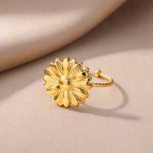 Detail showing a 18k gold plated sunflower ring with a twist rope band design