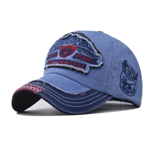 Detailed close-up of distressed brim and New York embroidery on vintage baseball cap