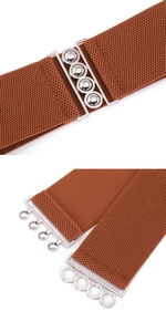 Detail showing the brown elastic belt with silver interlocking metal buckle mechanism