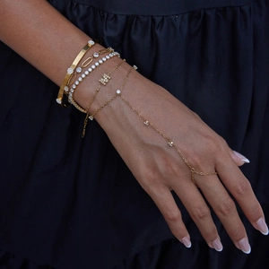 Gold paperclip chain bracelet set with cubic zirconia and a sparkling letter M hand chain