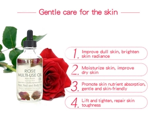 Detailed shot of rose multi-use oil bottle with dried petals and a red flower decoration