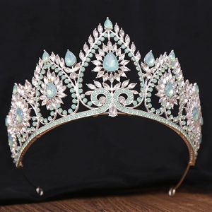 Detailed macro view of mint green teardrop opal and marquise crystals on a bridal tiara