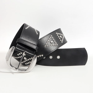 Detail of black leather belt with metal studs and silver buckle on white background