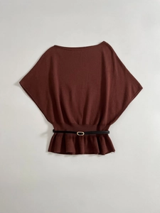 Detail view of burgundy boat neck knit top with fine texture and black belted waist