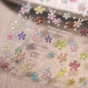 3D embossed floral nail stickers with colorful flowers and gold lettering accents