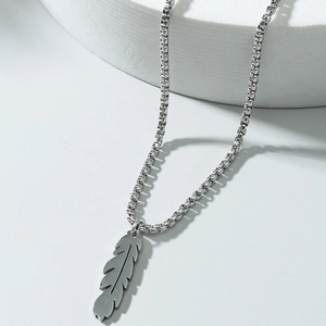 Minimalist stainless steel feather pendant necklace with a sleek silver box chain
