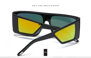 Detail showing the 180-degree flexible hinge and yellow mirrored lenses of the sunglasses