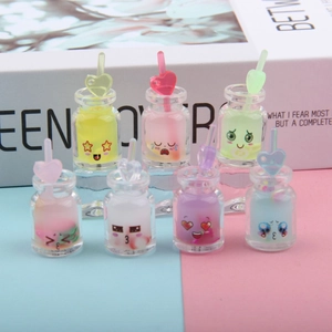 Set of 7 luminous resin mini bottles with cute faces and heart straws in pastel colors