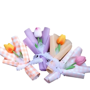 Mini artificial tulip bouquets in pink, yellow, orange and purple gift wrapping